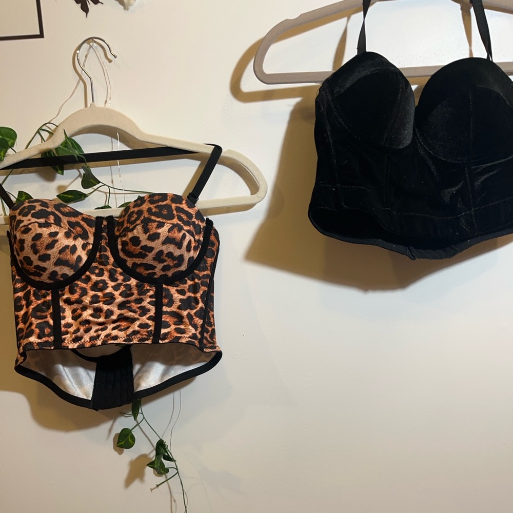 Pair of corset top. One cheetah print and one black velvet, medium sized corset.